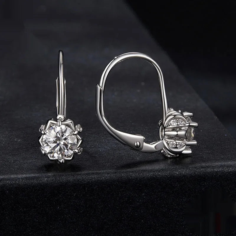 Sterling silver flower bud ear clips with white gold plating and moissanite centre stone