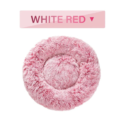 Fluffy donut-shaped dog bed in dark grey colour with raised edges, showing plush texture and circular design