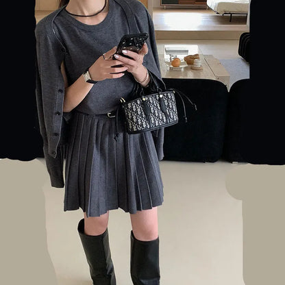 Women's grey art retro vest skirt and long-sleeved cardigan set with 3D pattern and adjustable belt.