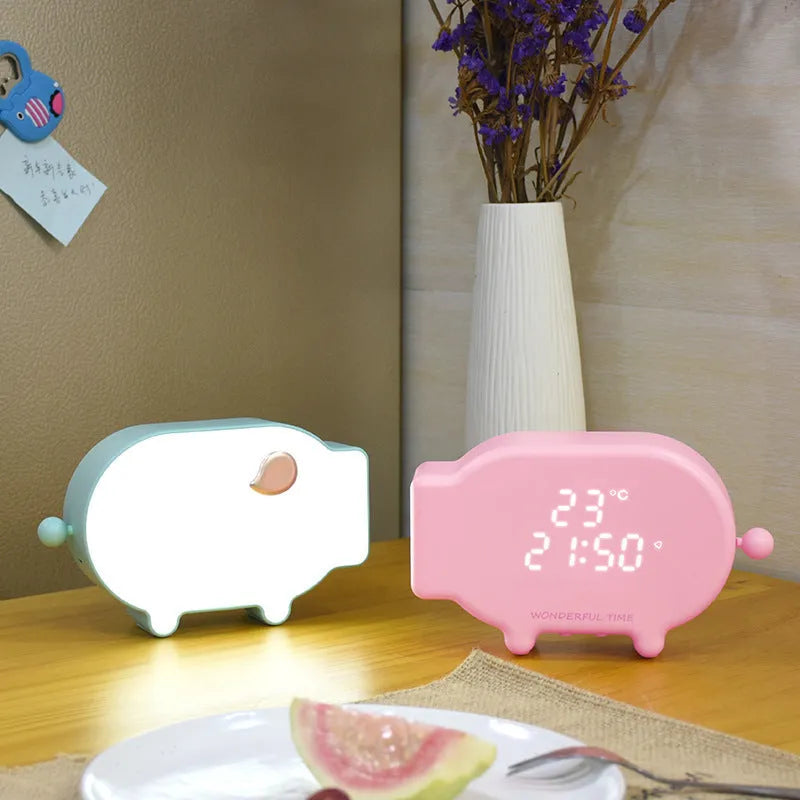 Blue multifunctional LED alarm clock showing time and temperature display with USB cable