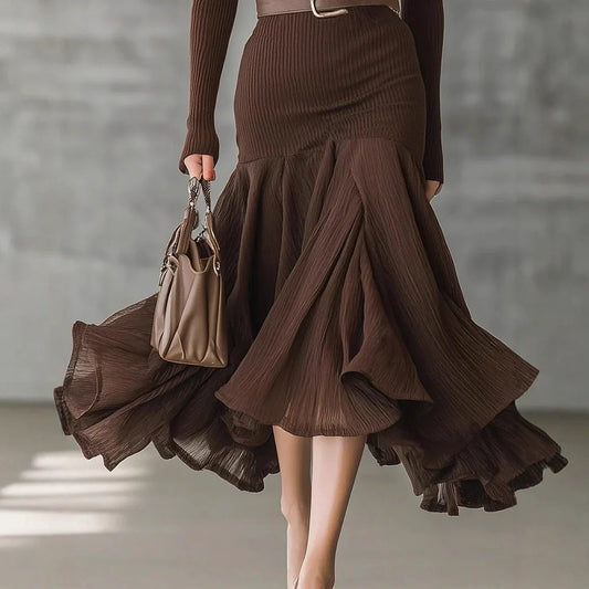 Dark brown asymmetric swing dress with V-neck and long sleeves on mannequin