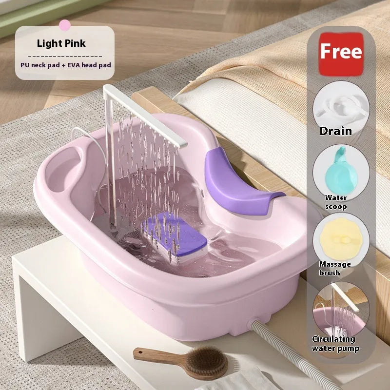 Portable plastic shampoo basin with neck pillow and water pump for bed hair washing.