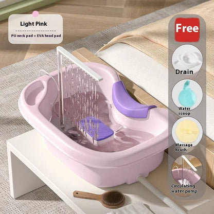 Portable plastic shampoo basin with neck pillow and water pump for bed hair washing.