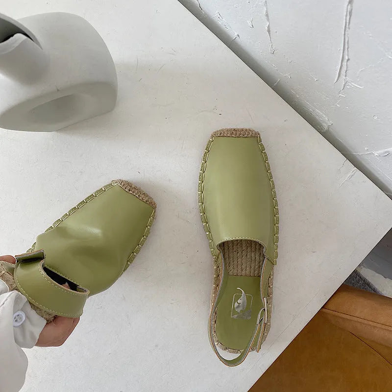 Women's beige retro fisherman flat sandals with animal pattern on canvas upper.