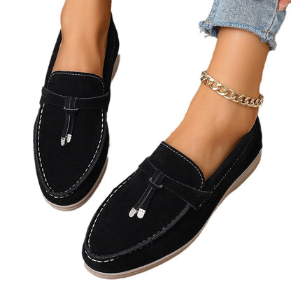 Solid colour canvas platform loafers with a rubber sole and round toe in apricot, shown from a side angle.