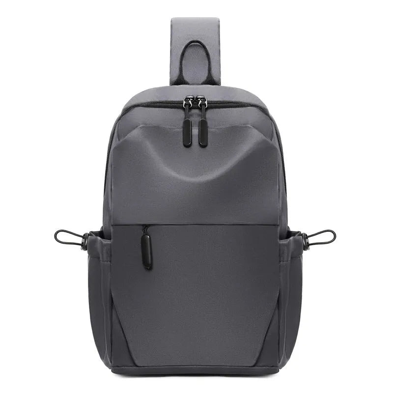 Grey waterproof polyester chest bag with shoulder strap showing 33cm height and 20cm width dimensions