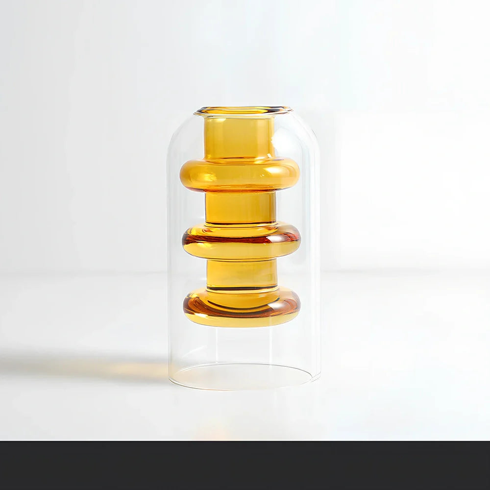 Transparent glass vase with colourful inner layer displaying dried flowers, 15cm tall on wooden table