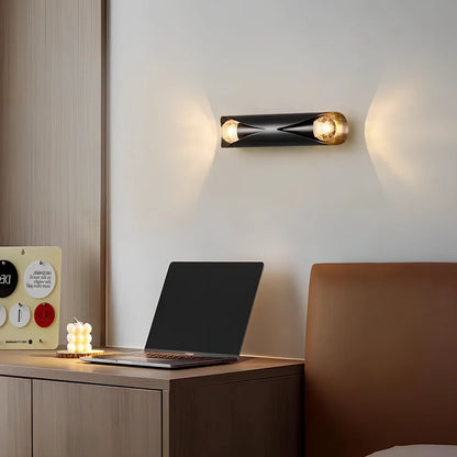 Copper wall lamp with matte black finish, 23cm × 5.5cm dimensions, warm light illumination