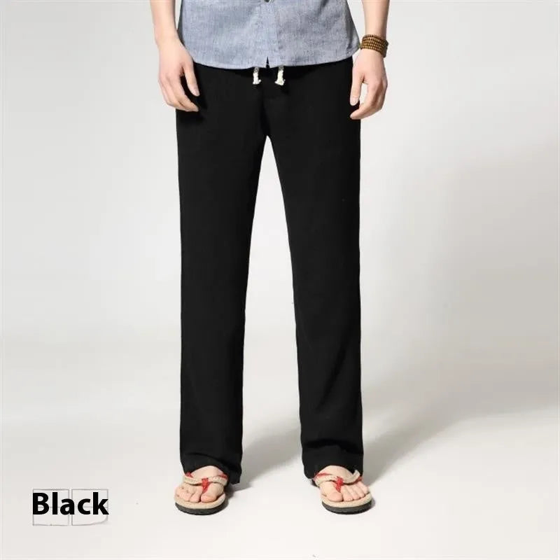 Men's straight leg casual trousers in cotton linen blend fabric showing loose fit and zip fly closure