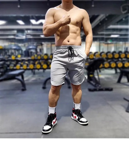 Men's thin quick-drying running shorts in black, blue, or grey, showing contrast colour detail.