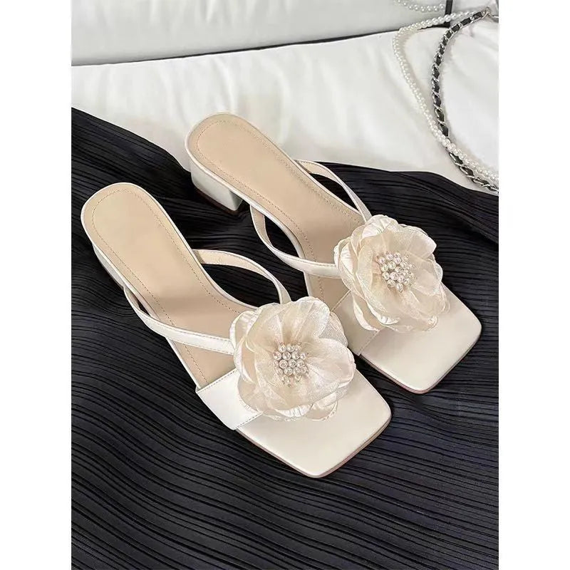 Women's chunky heel square toe sandals with satin upper in cream-white colour showing one-line strap design