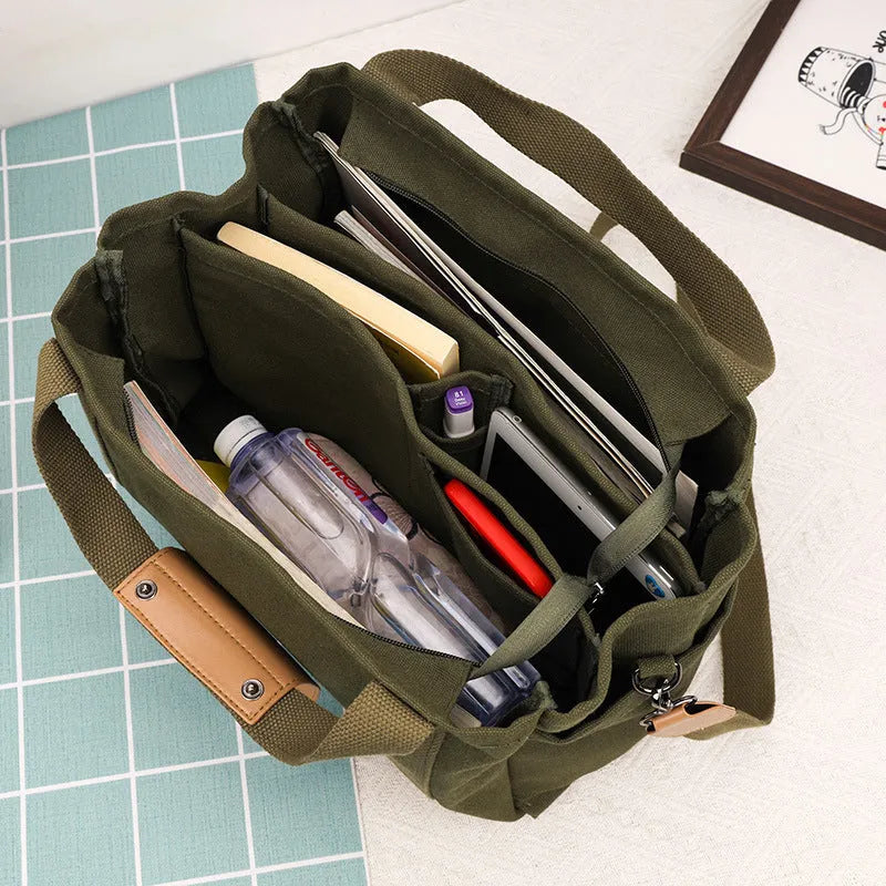 Army Green canvas tote bag showing open top with internal laptop pocket and organisers.