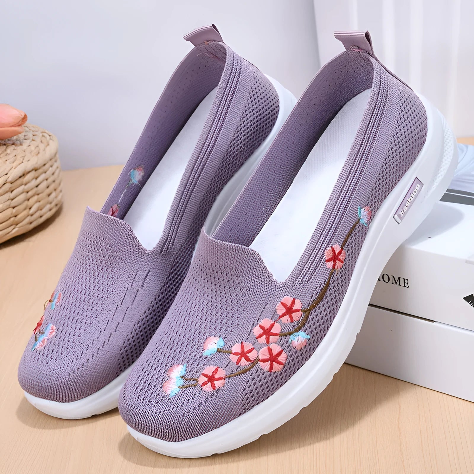 Women's low-top embroidered fly knit sports pumps in wine red with anti-slip sole.