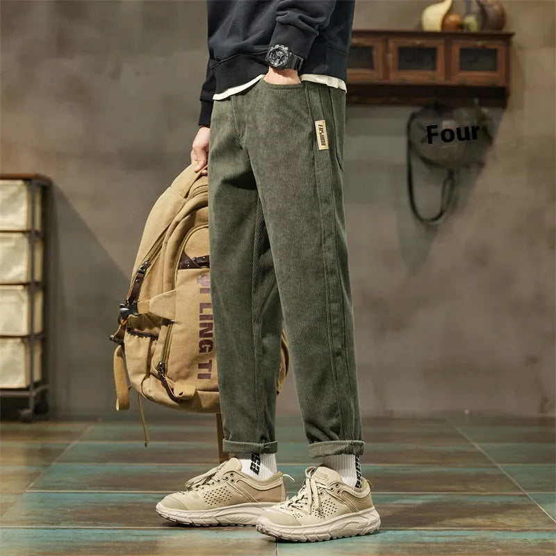 Men's straight-leg corduroy pants in army green colour with tapered fit and mid waist design