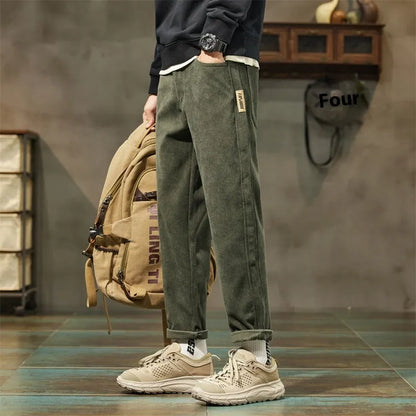 Men's straight-leg corduroy pants in army green colour with tapered fit and mid waist design