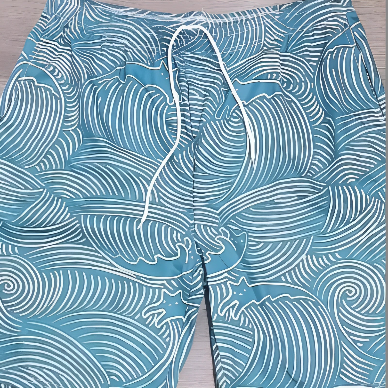 Man wearing loose-fit straight-leg sports shorts with a 3D digital print design on twill fabric.