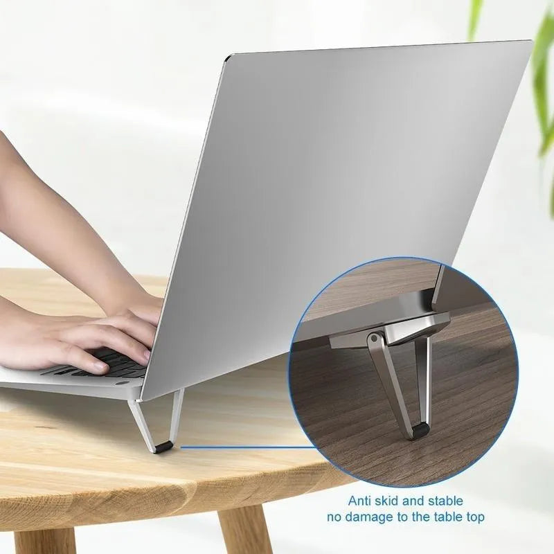 Folded aluminium laptop bracket showing compact 4.8cm size with 3M adhesive tabs