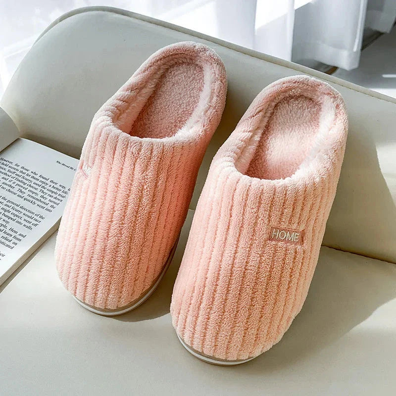Cozy cotton slippers in various colors, featuring a soft, plush lining and non-slip rubber sole for indoor comfort and warmth