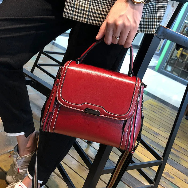 Women's genuine leather retro messenger bag in horizontal square shape with multiple internal compartments