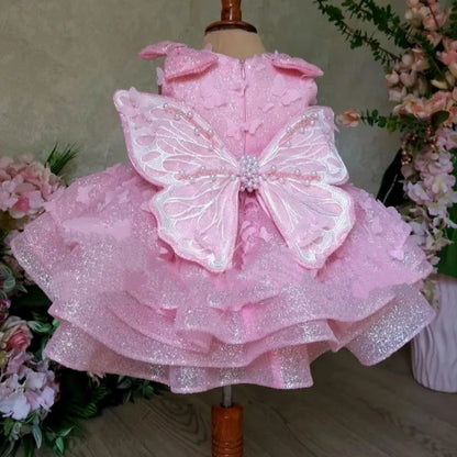 Pink sleeveless girls' dress with three-dimensional butterfly decoration on front