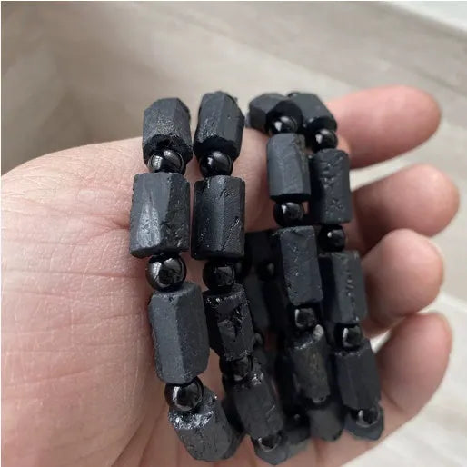 Natural black tourmaline rough stone bracelet with stretch cord on wrist