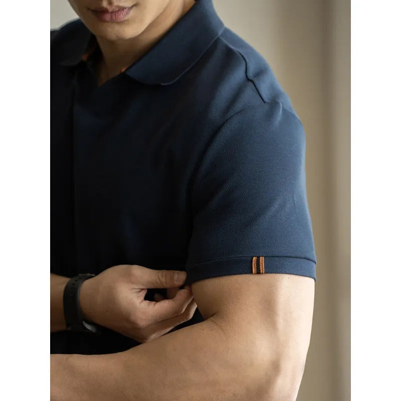 Light blue cotton polyester short-sleeved polo shirt on a hanger.