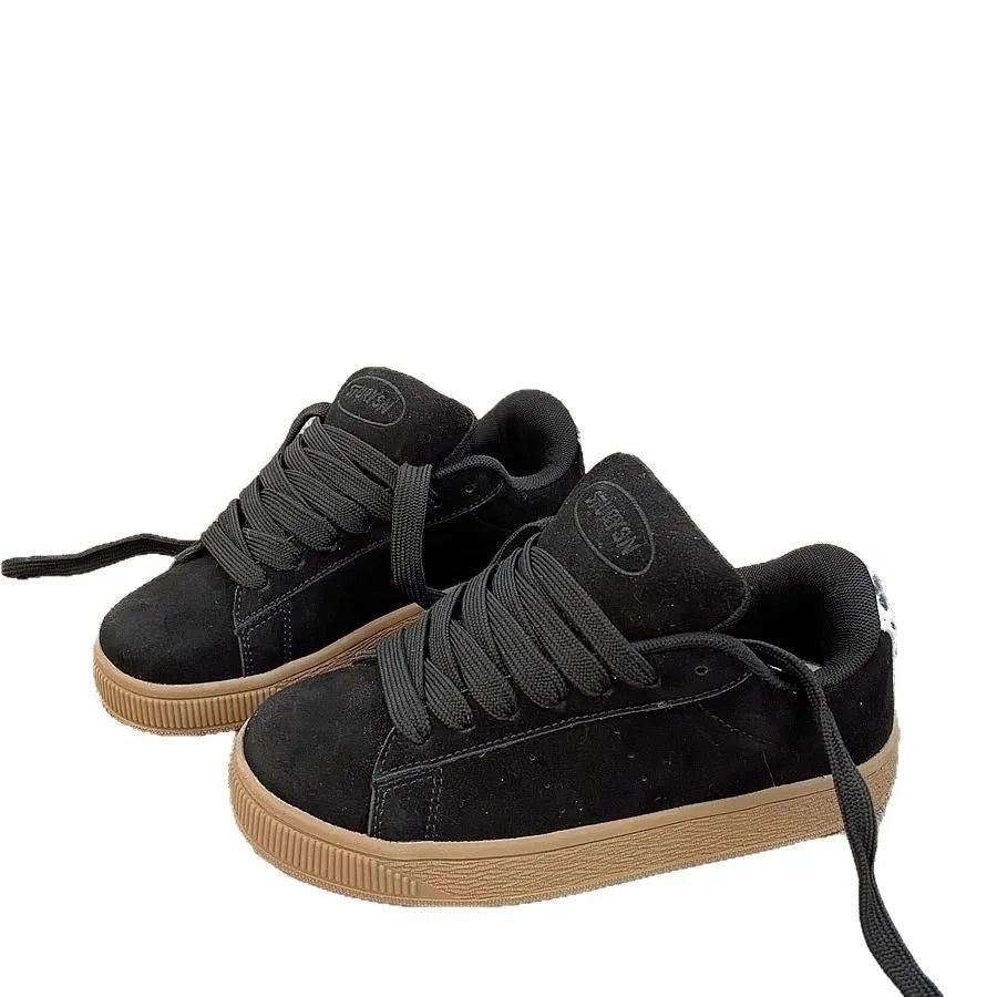 Black retro low-top sneakers with round toe, lace-up front, and a waterproof platform sole.