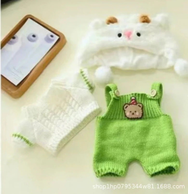 30cm doll clothing collection showing multiple outfit pieces including hooded jackets, sweaters, and suspender pants
