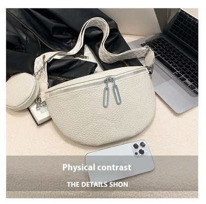 Women's solid colour PU crossbody bag with saddle lock zipper texture in clamshell design
