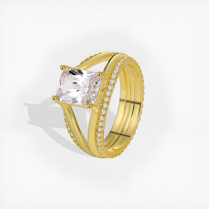 Gold electroplated geometric ring with a square zircon stone on a copper band.