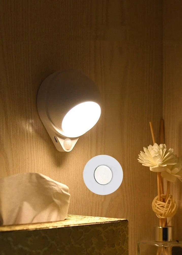 Wireless motion sensor light with USB charging port and adhesive mounting for wall installation