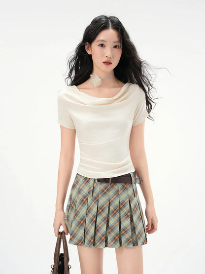 Women's one-shoulder draped neckline short sleeve top in slim fit with pleat detail, shown in Apricot