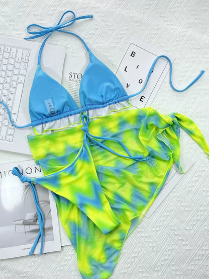 Tie-dye green nylon bikini set with bra, pants, and skirt for swimming