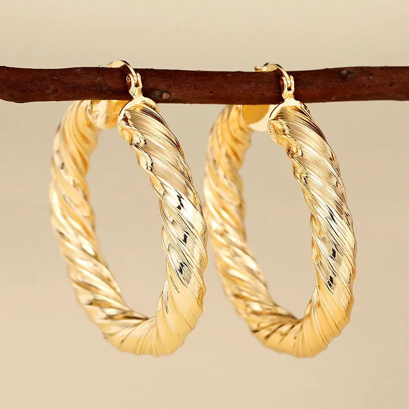 Geometric drop-shaped ear clip earrings with electroplated finish in various colours
