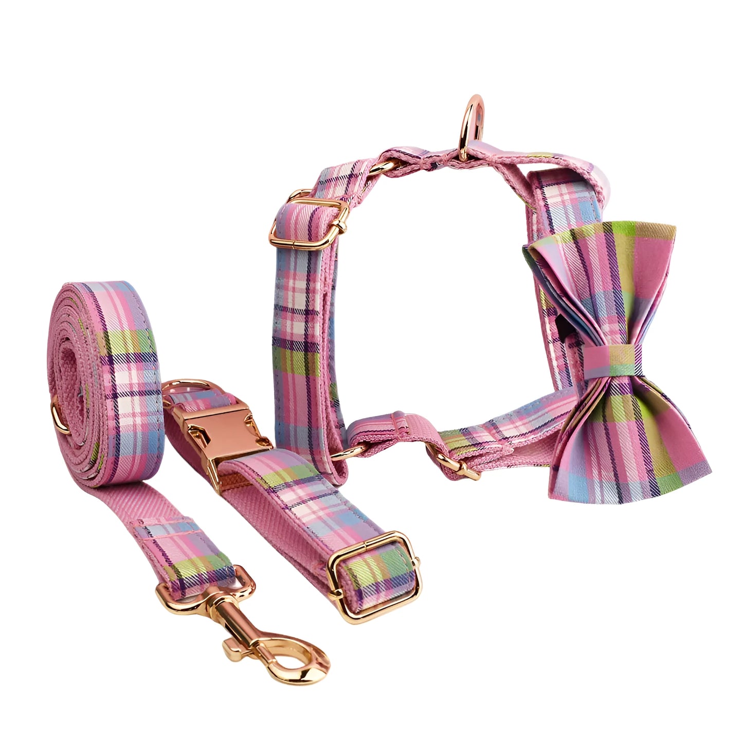 Four-piece dog accessory set showing adjustable collar, leash, mesh vest, and bow in coordinating colours