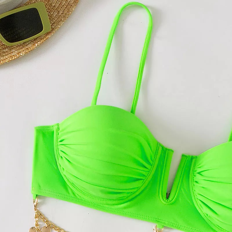 Women's solid color beach bikini with split design in black, pink, and green