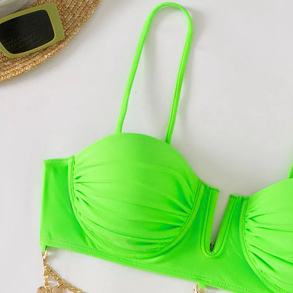 Women's solid color beach bikini with split design in black, pink, and green