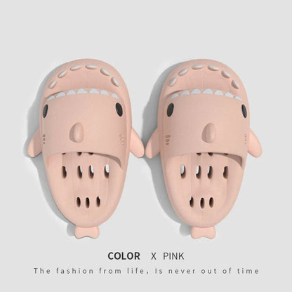 Colorful shark-themed shower slides with drainage holes, designed for comfortable and practical use in the pool or shower.