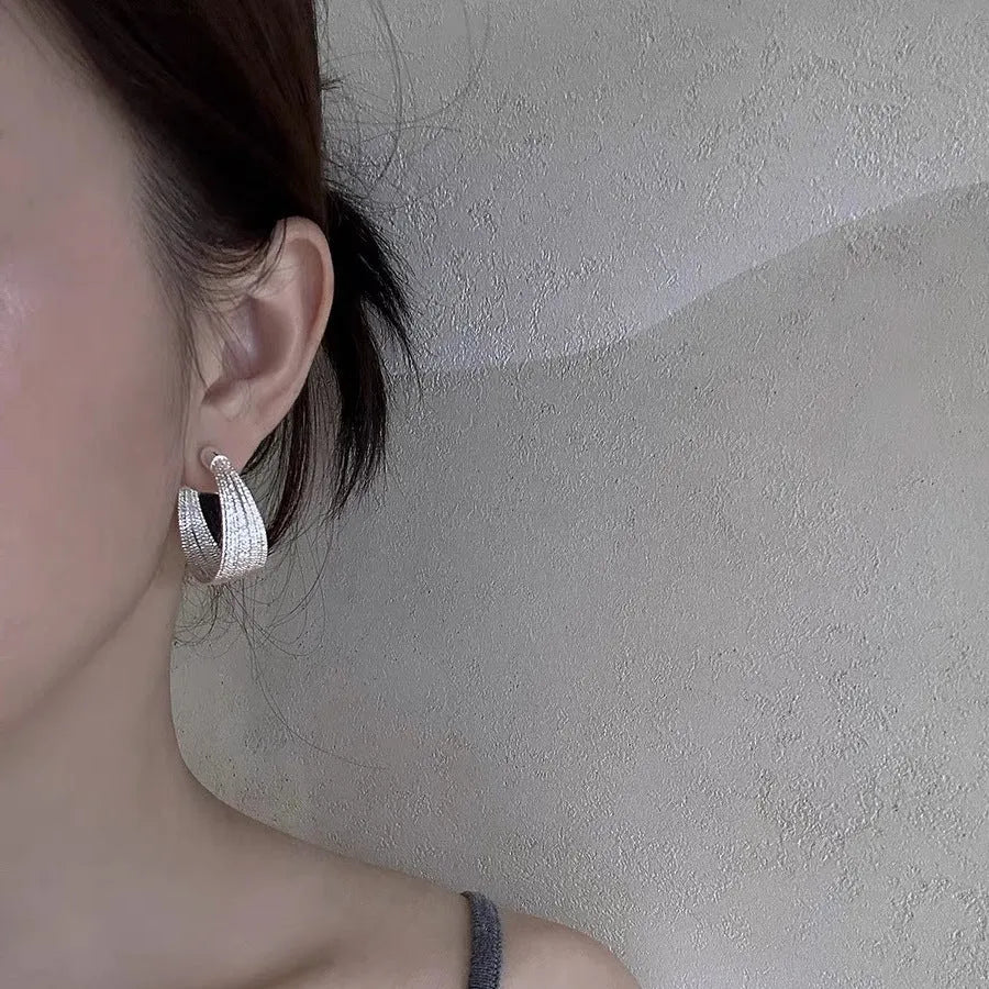 Geometric copper earrings set with gold and silver electroplated finish showing clip and stud options