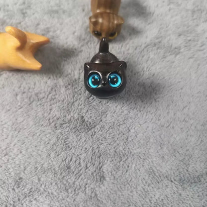 Handmade green sandalwood kitten ornament with unique design