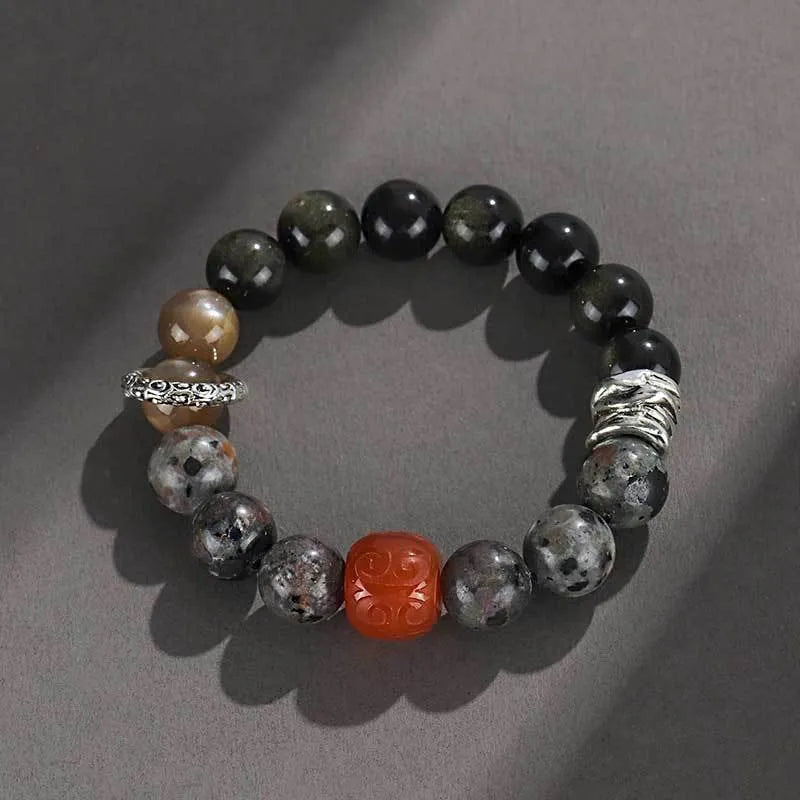 Gold obsidian, flame stone and red agate beads on unisex bracelet with manual processing