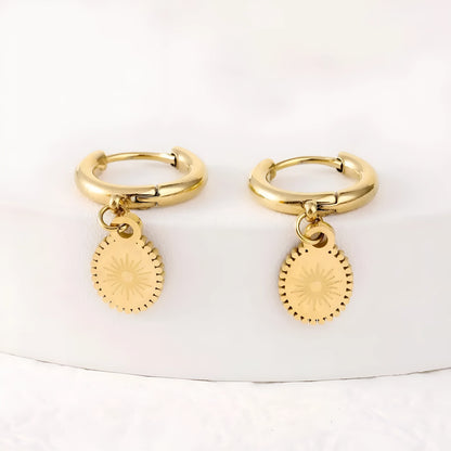 Geometric stainless steel earrings with ellipse design and ear button fastening, approximately 2-3cm diameter