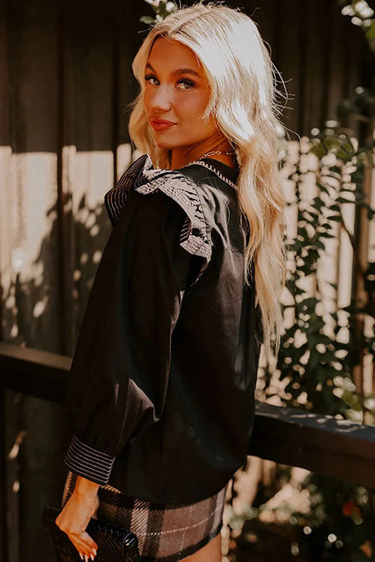 Black women's V-neck blouse with three-quarter ruffle sleeves and contrast stitching