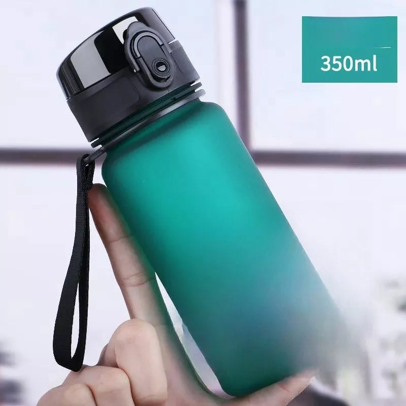 Large capacity Tritan sports water bottle in vibrant colors, perfect for hydration on the go