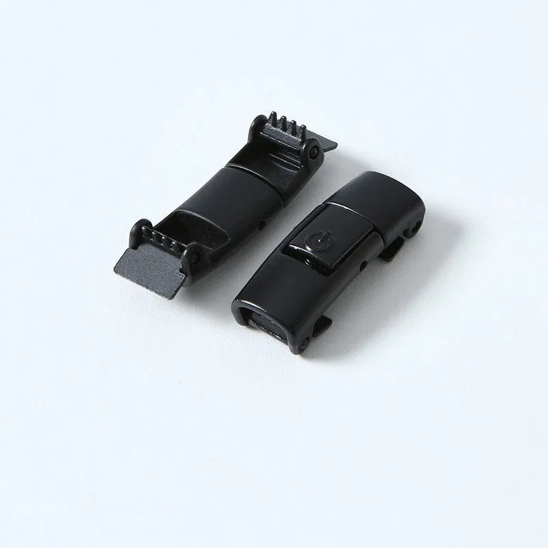 A pair of black widened flat elastic shoelaces with a silver press lock buckle on a white background.