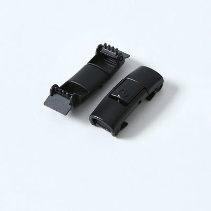 A pair of black widened flat elastic shoelaces with a silver press lock buckle on a white background.