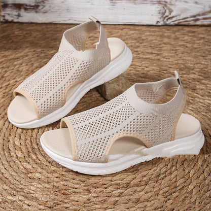 Women's platform sports sandals in black with mesh lining and a flat toe rubber sole.