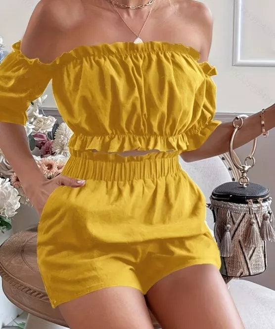 Women's two-piece short sleeve and shorts set in yellow and blue