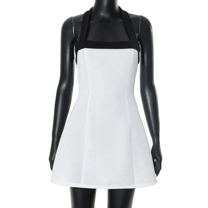 Chic off-shoulder mini dress with halter neckline, sleeveless design, and contrasting white and black colors