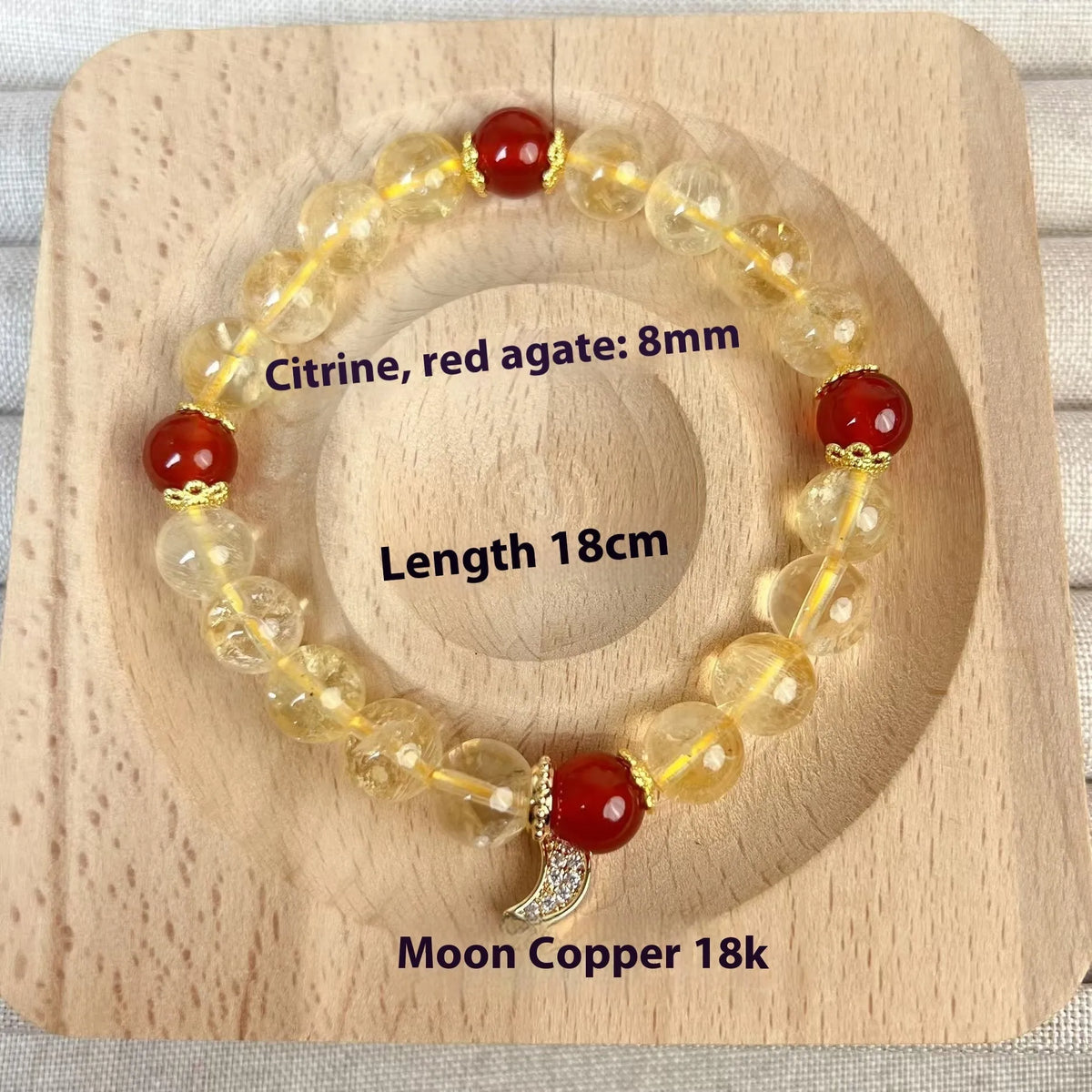Citrine red agate moon boom crystal bracelet for women on a white background.